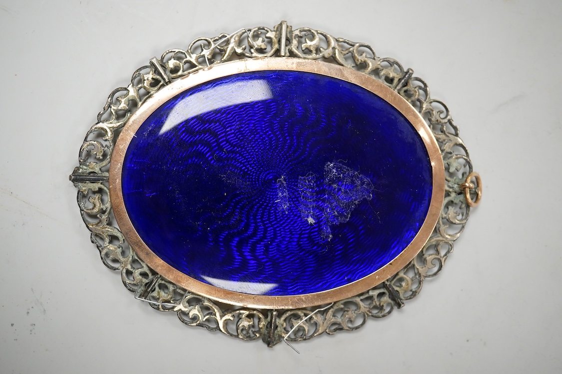 Alyn Williams (1866-1941), Portrait miniature of a young girl, signed and dated 1905, watercolour on ivory, guilloche enamel panel verso, housed in a white metal and amethyst set oval frame, overall 10cm high - CITES Sub